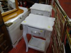 Two white painted bedside cabinets with single drawer and lower shelf and a storage box with motif