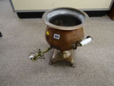 A copper tea urn