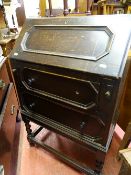 Small dark wood two drawer bureau