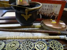 Brass bed pan, coal scuttle, horse brasses, walking stick and one other with a dog head handle, etc