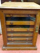 Small single glazed door collector's display chest with interior multi drawers
