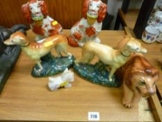Pair of Staffs dogs with baskets, pair of greyhounds and a Staffs lion etc