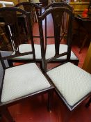 Set of four dining chairs with shell upholstered pads