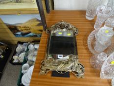 An art deco style portrait wall mirror