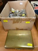 Box containing an assortment of flatware and a yellow metal State Express cigarette box