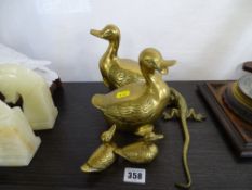 Two pairs of ornamental brass ducks and a similar style brass lizard