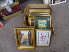 A box of paintings and prints