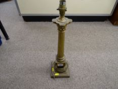 A brass corinthian column table lamp