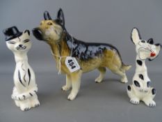 Beswick or similar alsatian and a pair of comic porcelain figures