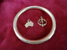 Nine carat gold - hollow bangle and two pendants, 19 grms approx