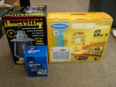 Two boxed insect control units and a boxed blood pressure arm monitor