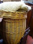 Vintage weave Ali Baba linen basket and a faux sheepskin rug