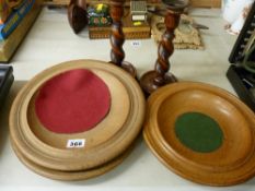 Quantity of treen altar dishes and a pair of twist candlesticks