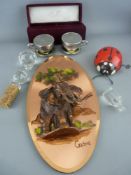 A Godinger boxed Silver Treasures cruet in the form of cups and saucers, a copper effect wall
