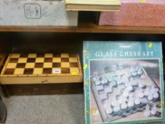 Modern cased wooden chess set and a boxed glass example