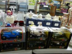 Six boxed Burago diecast display vehicles