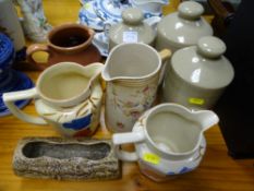 Collection of pottery jugs and stoneware hotwater bottles etc