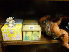 Two boxed 'Piggin' figurines, two vintage sweet tins and a modern composite cherub figurine