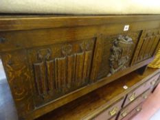 Carved oak blanket box with linenfold detail