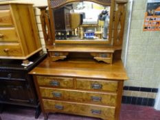 Circa 1900 walnut mirrored dressing chest having two uppers drawers with a shelf over two short