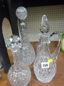 Vintage glass claret jug and three decanters