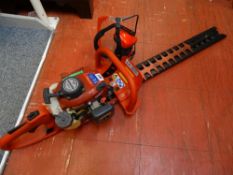 Kawasaki TH23 petrol hedge trimmer and accessories