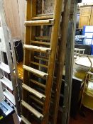 Parcel of five wooden and metal ladders and stepladders and a metal framed sun lounger