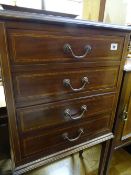 Four drawer bedside cabinet with inlaid detail and tapered supports
