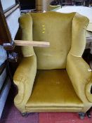 Vintage mustard coloured wingback armchair