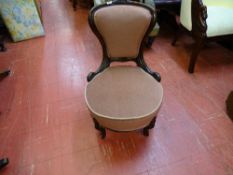 Pink upholstered spoonback nursing chair
