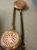 Antique chestnut roaster with long wooden handle and a similarly styled bedwarmer