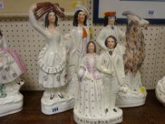 Three Staffs pottery flatback figurines including one of a boy seated on a goat