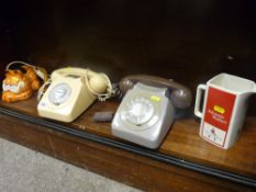 Two vintage telephones, a Garfield Cat telephone and a Wade Johnnie Walker whisky water jug