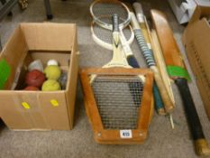 Three vintage tennis racquets, two hockey sticks, cricket bat with wickets and a boxed quantity of