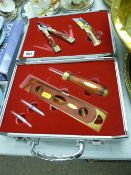 Presentation set of brass and wooden hand tools in a fitted silver coloured travel case