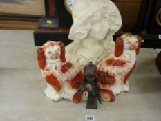 Pair of brown and white Staffs dogs, metallic bust of a lady and a plaster bust