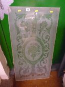 Floral swag etched pane of glass