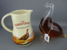 Glass decanter in the form of the Famous Grouse whisky bird and a water jug advertising the same