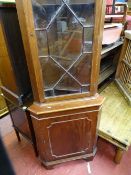 Rustic style coffee table and a floorstanding corner cupboard with upper glazed door
