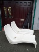 Pair of fibreglass vintage recliners and metal framed overhead parasol