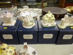 Four boxed Coalport bone china cottages