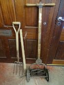 Vintage manual lawnmower 'Ransome's Ace Ballbearing', a small pick and a garden fork