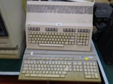 Commodore A1200 Amiga computer, Commodore 128 personal computer and an Atari 1040ST computer E/T