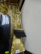 Three piece brass companion set with non-matching coal tongs, poker and hearth brush