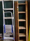 Metal threeway stepladder, smaller metal stepladder and a three section wooden ladder