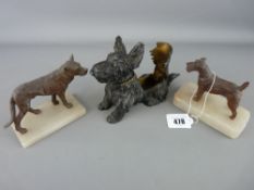 Vintage cast metal lighter/ashtray in the form of a terrier and two metal dog figurines on marble