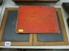 Child's vintage double slate board and a part filled album of Wills cigarette cards
