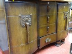 Vintage sideboard with four central drawers and two flanking cupboards