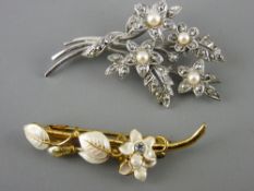 Marcasite and seed pearl brooch on a white metal floral back and a yellow metal brooch with leaf
