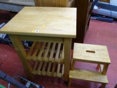 Modern kitchen work table with slatted undershelf and a pine two step stool